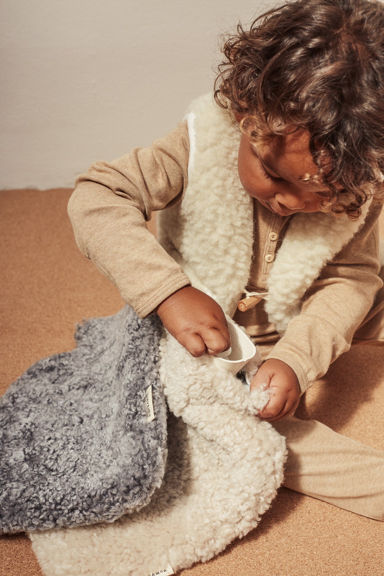 sheepskin hot water bottles by binibamba in grey and milk