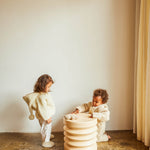BINIBAMBA Milk Snuggle Jacket & little boy wearing Peanut Snugglesuit