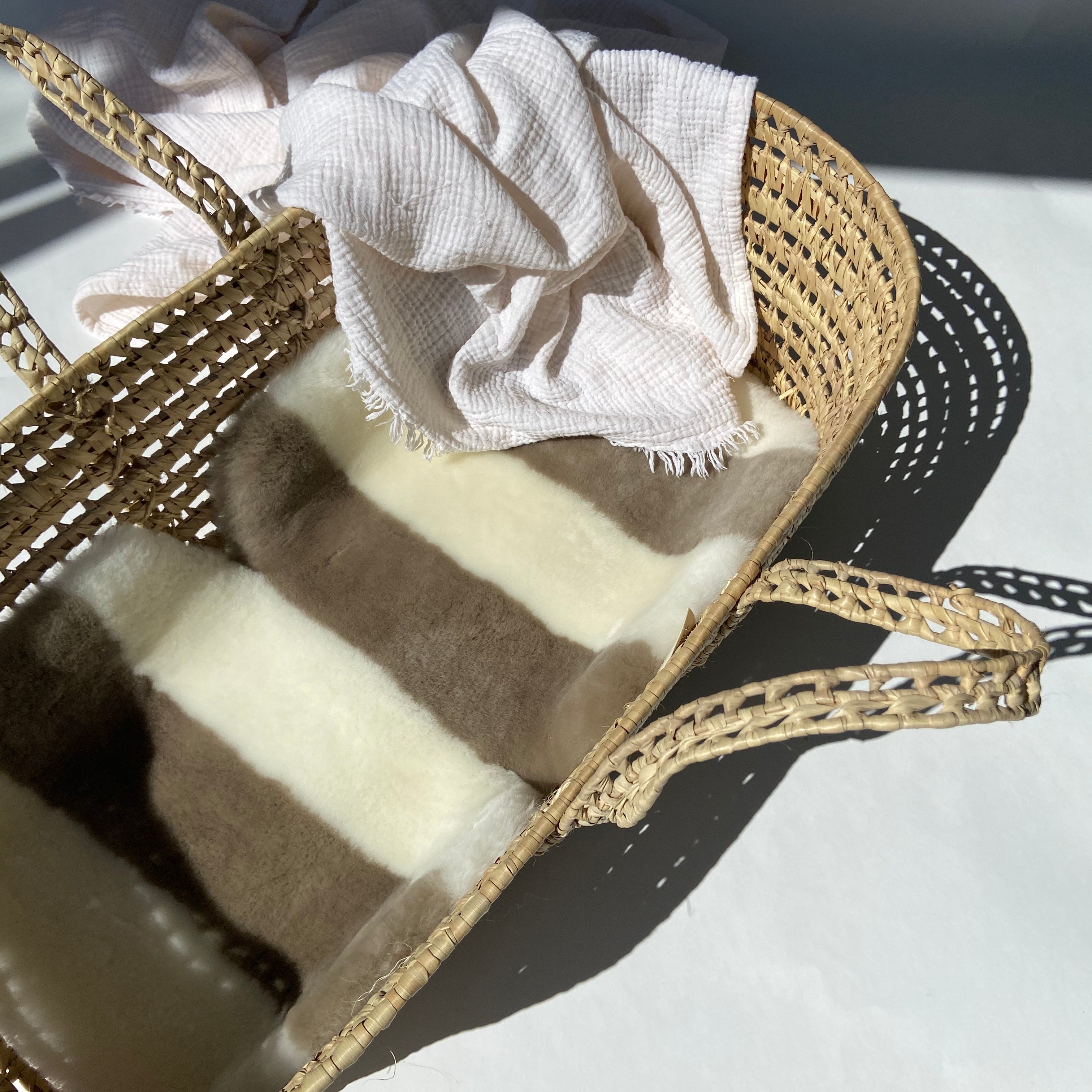 LIBERTY X BINIBAMBA STRIPE SHEEPSKIN BUGGY LINER IN A MOSES BASKET FOR BABY